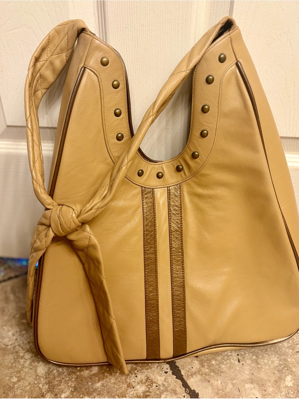 M.I.L.K. handbags, tan leather purse with bronze accent stripes